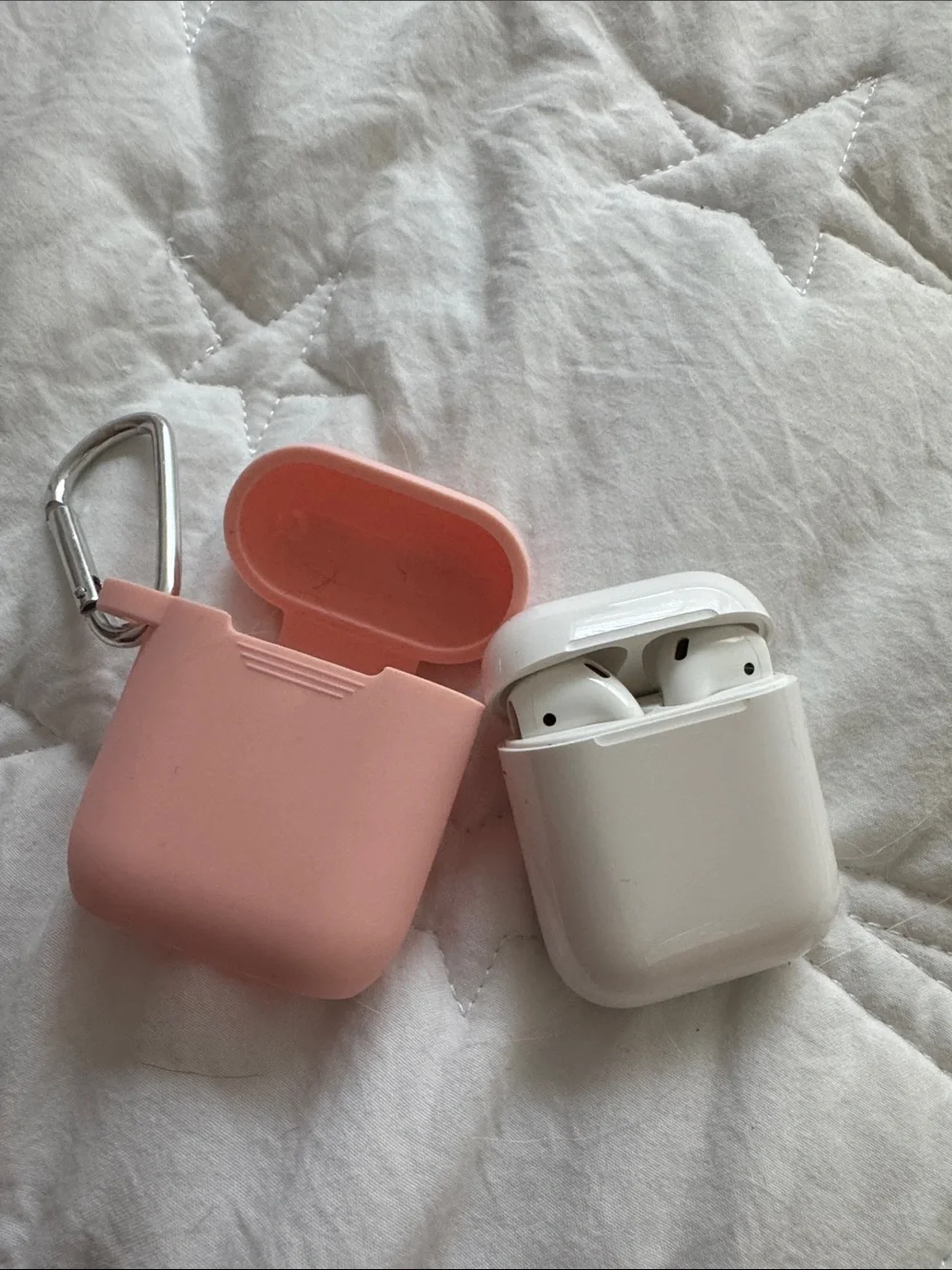 Apple White Wireless Earbuds with Pink Silicone Case and Carabiner